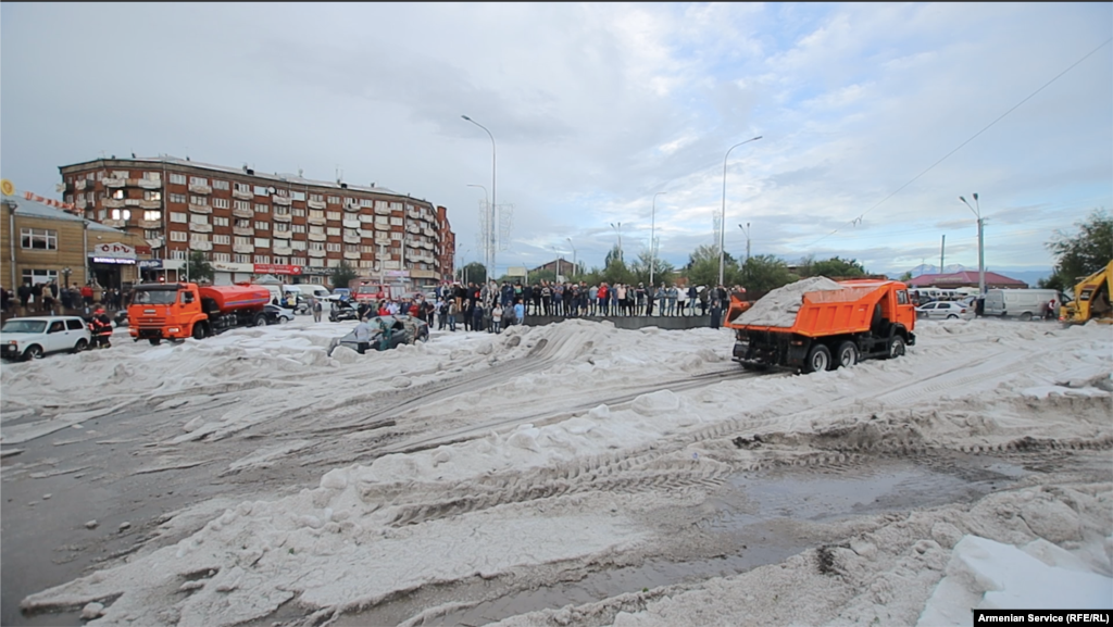 Piles of hail being hauled away by municipal workers on July 14 after the storm &nbsp; About 8 centimeters of rain and hail &ndash; the average for the entire month of July -- fell in less than an hour during the July 13 downpour. &nbsp;