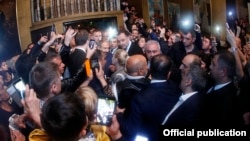 Russia - Armenian Prime Minister Nikol Pashinian is mobbed by supporters in an Armenian church in Sochi, 13 May 2018.