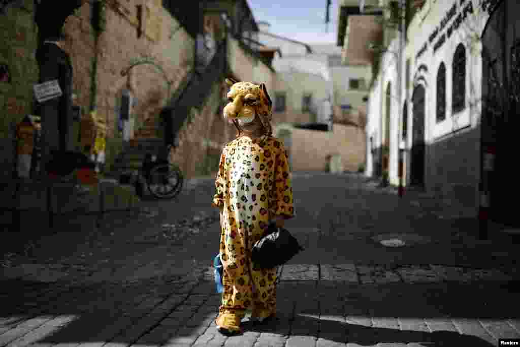 An ultra-Orthodox Jewish boy wears a costume ahead of the Jewish holiday of Purim in Jerusalem's Mea Shearim neighborhood. (Reuters/Amir Cohen)