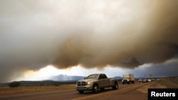 U.S. -- Smoke from the Waldo Canyon fire hovers over the I-25 north of Colorado Springs in Colorado, 26Jun2012