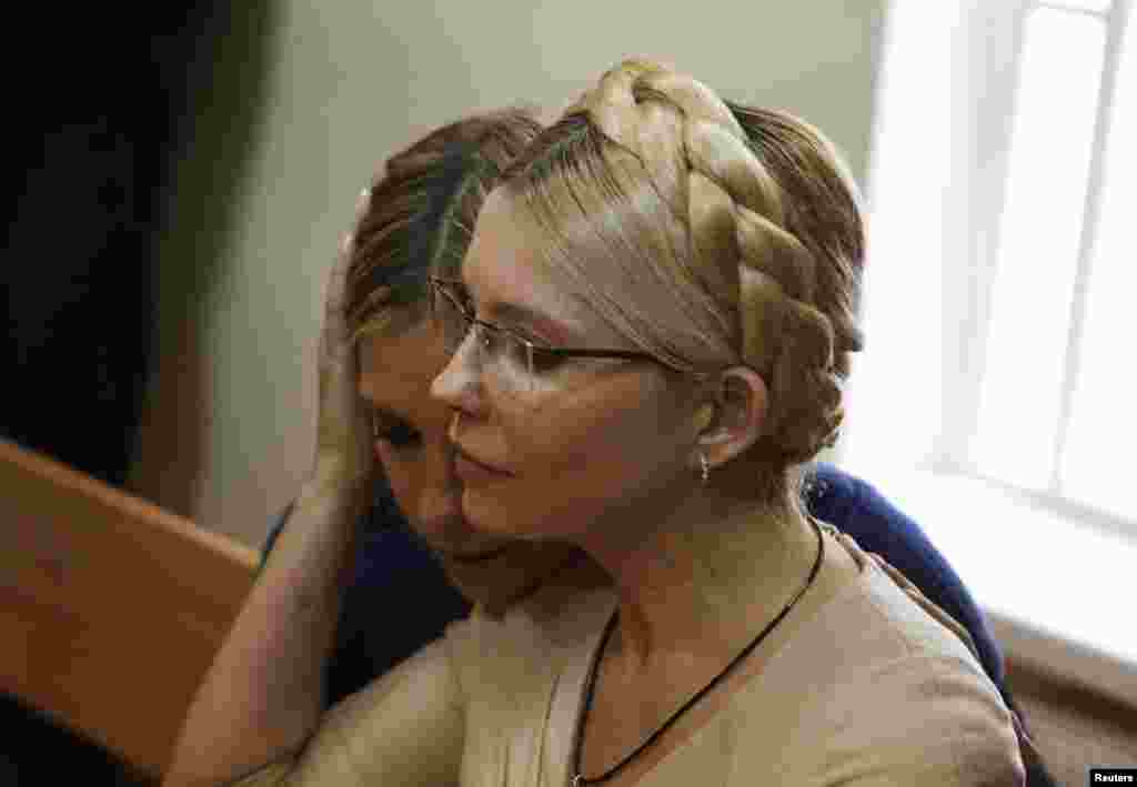 Yulia Tymoshenko is comforted by her daughter Yevhenia in after the verdict is read. Yevhenia has been advocating for her mother's release from prison.