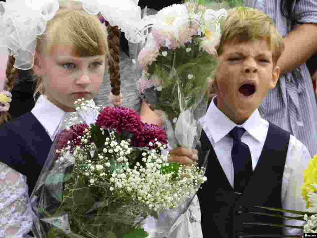 A child yawns during a ceremony to mark the start of another school year in Russia's Far Eastern city of Vladivostok. (Photo by Yuri Maltsev for Reuters)