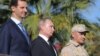 Putin Visits Syria Base, Orders Partial Russian Withdrawal