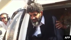 Abdullah Senussi, a former spy of late Libyan leader Muammar Qaddafi, arriving at the high-security prison facility in Tripoli in September 2012.