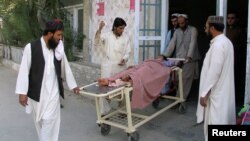 Relatives move a boy who was injured during border clashes between Pakistani and Afghan forces at a hospital in Chaman on May 5. 