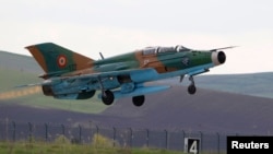 A MiG-21 Lancer takes off during training exercises at a military airfield in Campia Turzii in Transylvania, Romania, in 2014.