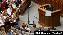 Ukrainian President Volodymyr Zelenskiy addresses parliament in Kyiv on August 29, announcing the country's new government.