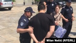Serbian police arrested two participants in a May Day protest who they say verbally attacked Labor Minister Zoran Djordjevic.
