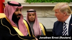 U.S. President Donald Trump shakes hands with Saudi Arabia's Crown Prince Mohammed bin Salman in the Oval Office at the White House in Washington, March 20, 2018