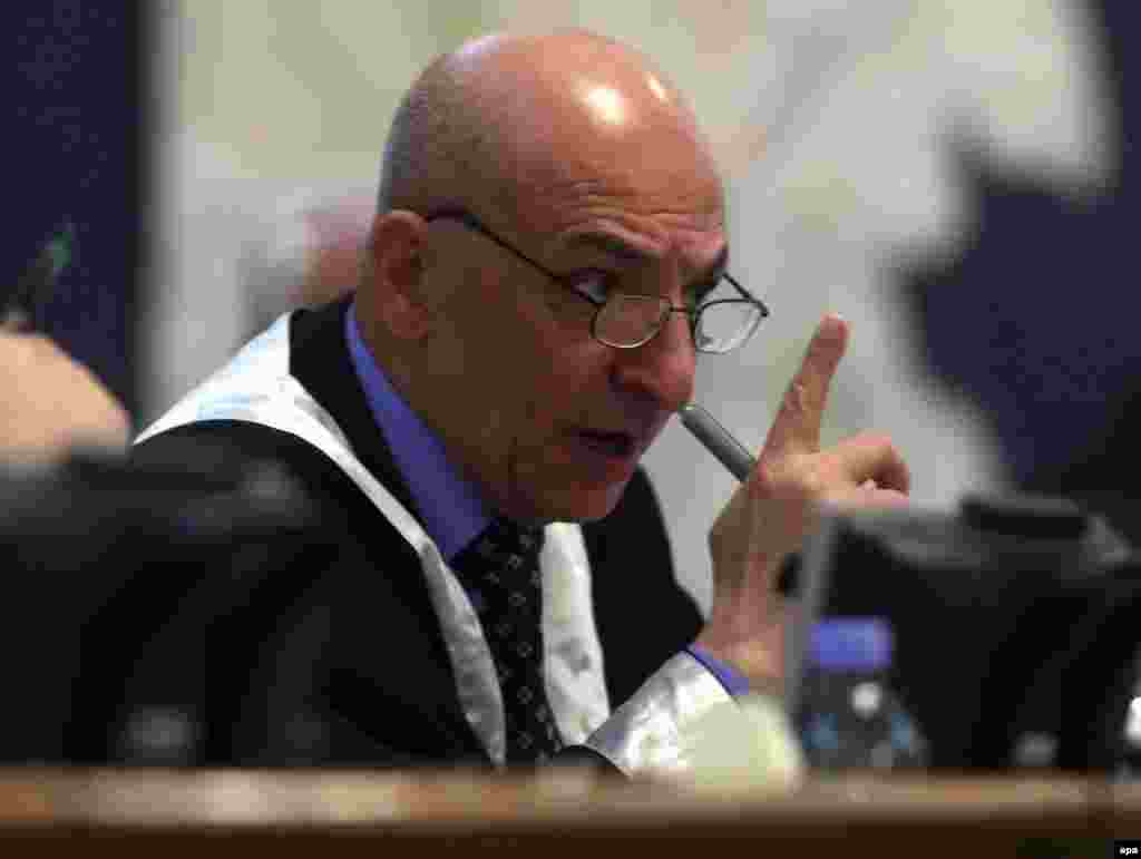 Judge Ra'uf Rashid Abd al-Rahman reading the verdicts against Saddam Hussein and the other defendants in Baghdad on November 5 (epa) - After a controversial trial that lasted more than a year, former Iraqi President Saddam Hussein and his fellow defendants were sentenced on November 5.