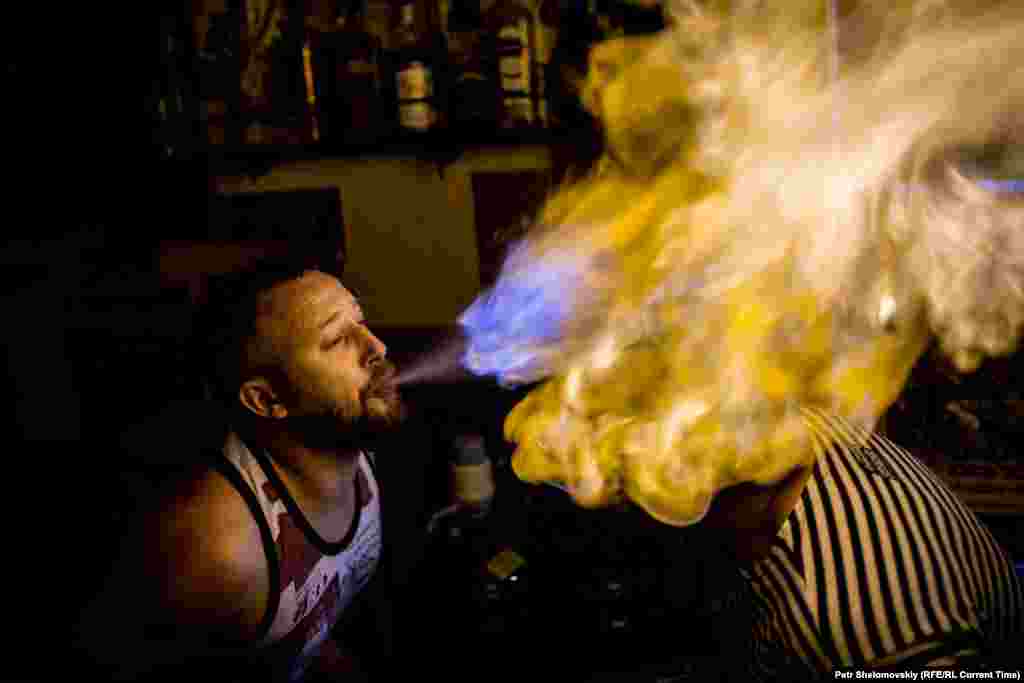 The bartender&#39;s favorite trick &mdash; setting light to an alcohol-soaked Soviet army helmet.&nbsp;