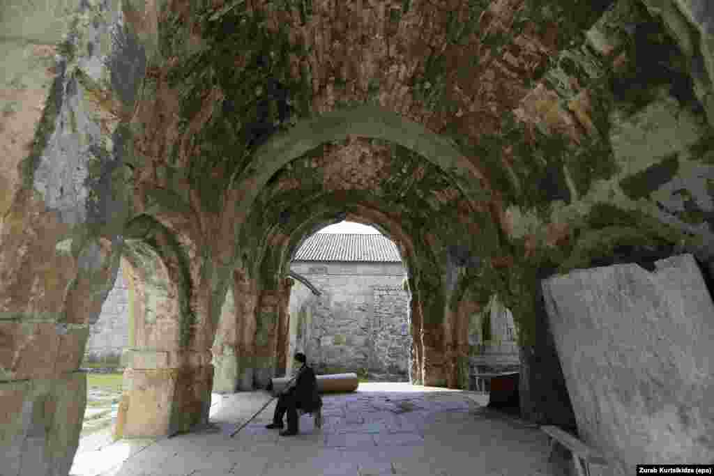 GEORGIA MONUMENTS -- A person sits on a bench at the Georgian orthodox Gelati Monastery complex near the town of Kutaisi, Georgia, 11 July 2017 (issued 12 July 2017).