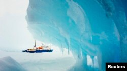 A photo by passenger Andrew Peacock from December 30 of the Russian research vessel "MV Akademik Shokalsky" stuck in the ice off East Antarctica awaiting rescue.