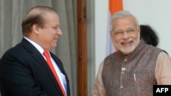 Indian Prime Minister Narendra Modi (R) met with Pakistani Prime Minister Nawaz Sharif in New Delhi on May 27, 2014.