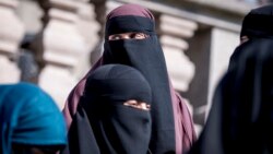 DENMARK -- Women wearing the niqab exit the Danish Parliament at Christiansborg Castle in Copenhagen, May 31, 2018