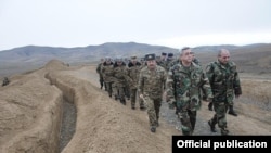 Armenian President Serzh Sarkisian (front left) visits a Karabakh Armenian army unit on January 3.