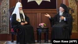Russian Orthodox Church Patriarch Kirill (left) and Orthodox Ecumenical Patriarch Bartholomew I meet at St. George Church in Istanbul on August 31. 