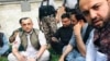 Amrullah Saleh (L) surrounded by his supporters after the attack 