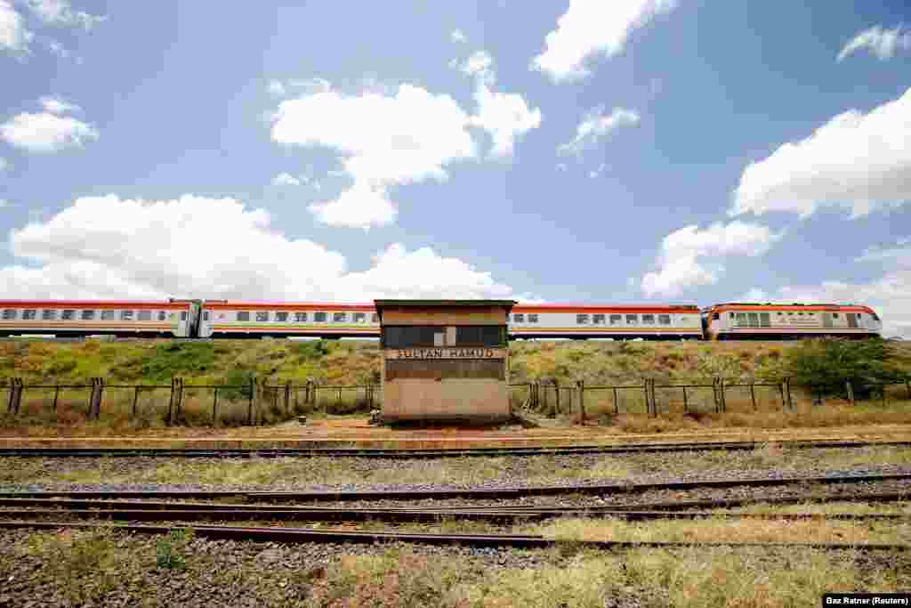 An SGR passenger train travels past the the town of Sultan Hamud, Kenya, February 13, 2019.