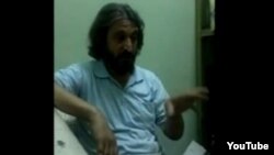 Iranian activist Heshmatollah Tabarzadi in YouTube video apparently recorded covertly in Rajayishahr prison and posted on January 1.