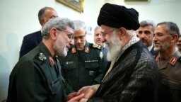 Iran's Supreme Leader Ali Khamenei receiving Esmail Qa'ani (Ghaani) during a meeting with military commanders. Undated. FILE photo