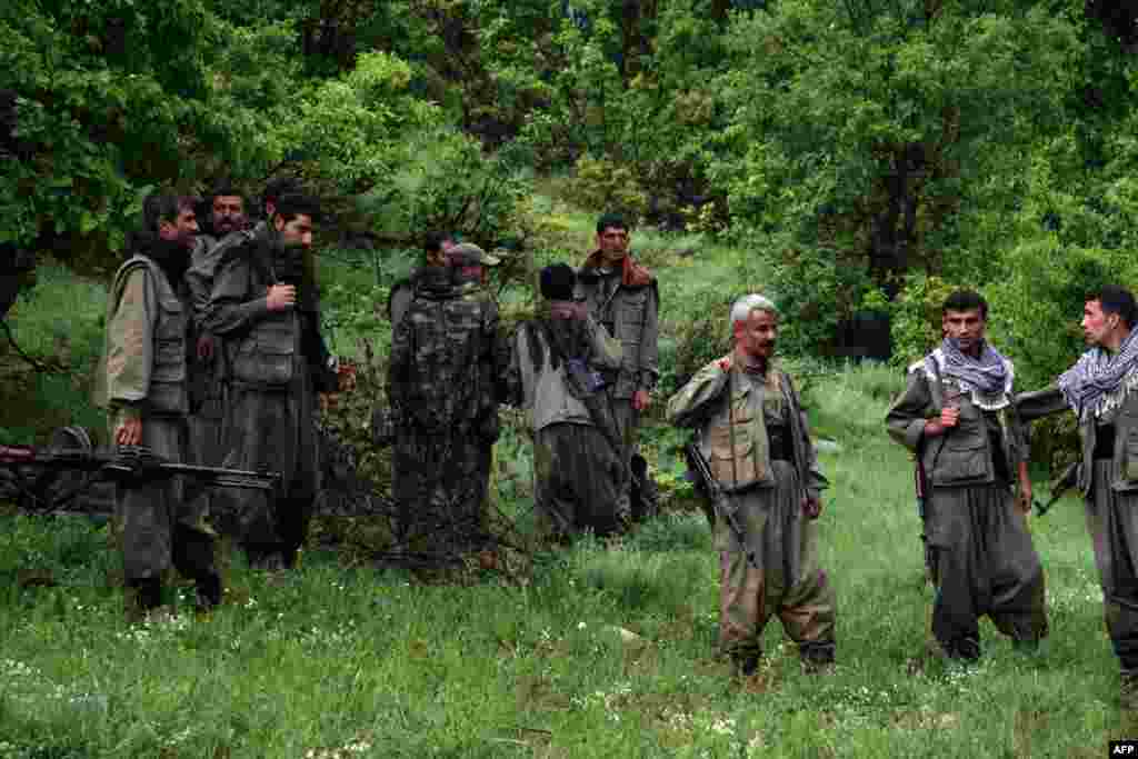 Iraq -- Kurdistan Workers' Party (PKK) fighters greet their comrades as they arrive in the northern Iraqi city of Dohuk, 14May2013