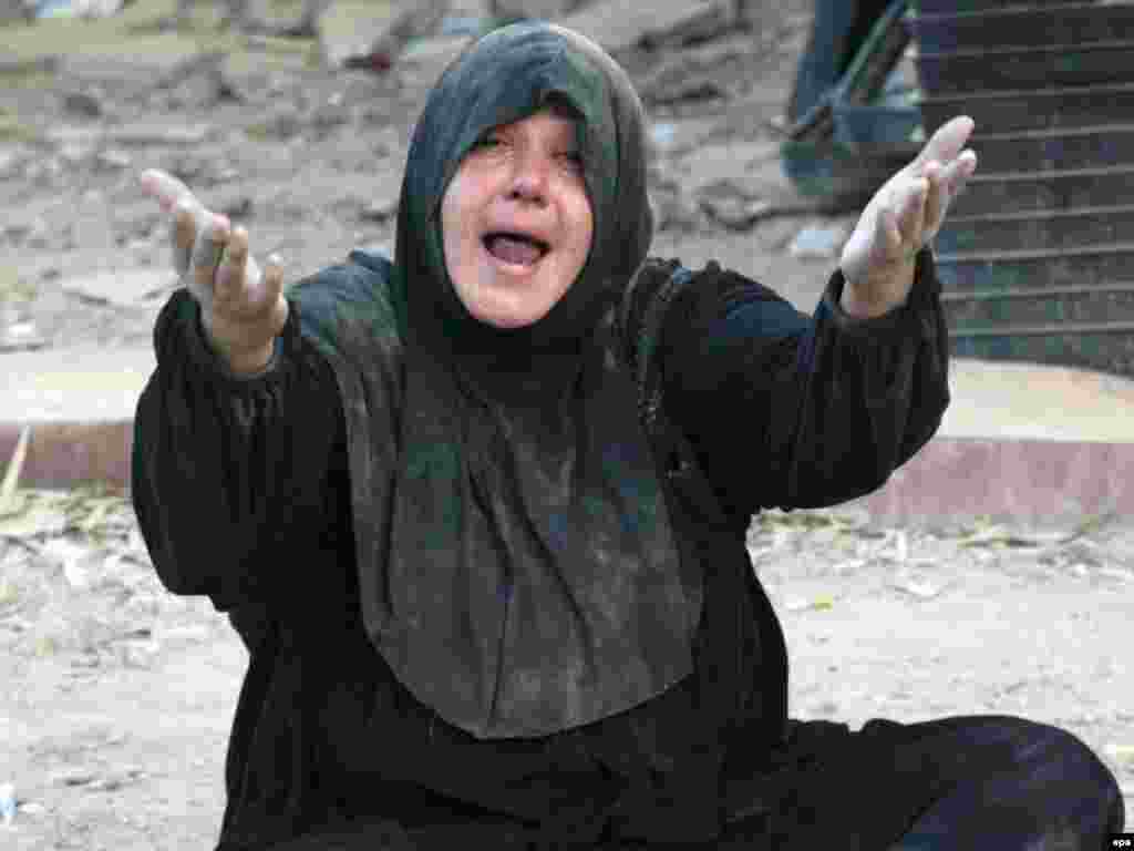 The ongoing war in Iraq - An Iraqi woman weeps during the funeral of her relative who was killed during clashes between U.S. forces and Al-Mahdi Army in Sadr City, Baghdad, Iraq 23 April 2008. At least 16 people were killed and another 36 wounded in overnight clashes.