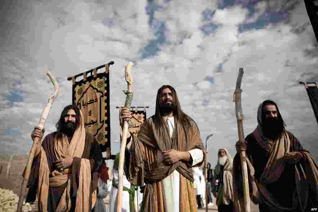 Iranian Shi'ite Muslims portray the Prophet Jesus and his apostles during a traditional Ta'zieh performance in Noosh Abad, Iran, near the central city of Kashan.
