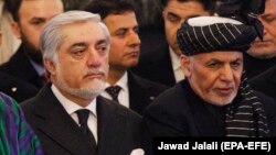 Президентликка номзод Абдуллоҳ Абдуллоҳ (ўнгда) ва президент Ашраф Ғани, 13 февраль, 2019 йил