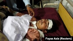A man injured in a blast in Orakzai lies at a hospital bed after he was brought for treatment in Peshawar on November 23.