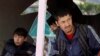 An Afghan men look out through a broken window at the site of a suicide attack in Kabul on April 22.