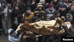 Похороны погибшего в ходе антиправительственной демонстарции в Баба-Амро, 29 января 