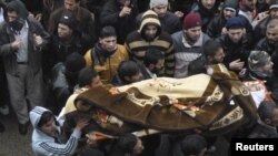 Похороны погибшего в ходе антиправительственной демонстарции в Баба-Амро, 29 января
