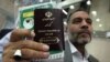 Iran - a man holds his passport in his hand . UNDATED