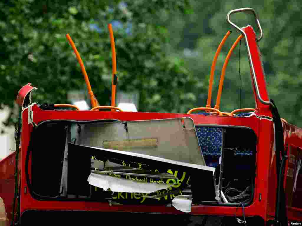 The bomb destroyed number 30 double-decker bus in Tavistock Square in central London July 8, 2005. Police have stated that over 50 people have been killed in the four blasts that tore through three underground trains and the bus and have added that the scene is too dangerous to remove bodies from the underground carriages. REUTERS/Dylan Martinez P 