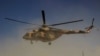 An Afghan helicopter during an offensive against Taliban insurgents in Kunduz in September 