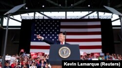 Donald Trump reacts with supporters during a campaign rally in Panama City, May 8, 2019