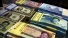 Iranian and U.S. banknotes on display at a currency exchange shop in downtown Tehran. FILE PHOTO