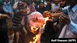 Pakistani Peoples Party activists burn an effigy of Indian Prime Minister Narendra Modi during a protest on March 1.