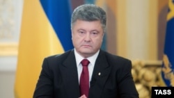 Ukraine -- President Petro Poroshenko (C) during his broadcast address to the nation, June 21, 2014