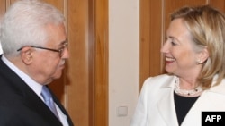 U.S. Secretary of State Hillary Clinton greets Palestinian leader Mahmud Abbas in Sharm El-Sheikh earlier this month.