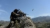 An Afghan soldier fires during an ongoing an operation against Islamic State (IS) militants in the Achin district of Nangarhar Province on April 11.
