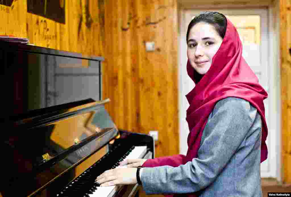 Negin Khalpak, 14, conducts around 35 students in the institute&#39;s orchestra.