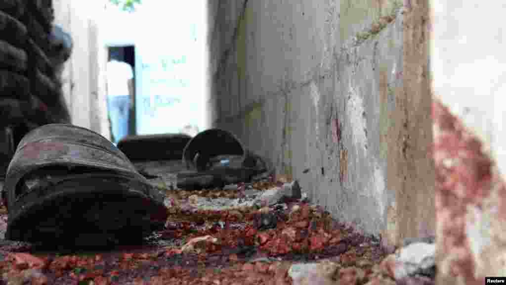 A pair of sandals lies on bloodstained ground after shelling at the Talbisah area in the Syrian city of Homs. (Reuters/Shaam News Network)