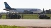 Maltese troops survey a hijacked Libyan Afriqiyah Airways Airbus A320 on the runway at Malta Airport