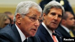 U.S. Secretary of Defense Chuck Hagel (left) testifies alongside Secretary of State John Kerry at a U.S. House Foreign Affairs Committee hearing on Syria in Washington on September 4.