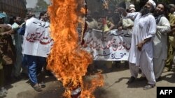 Pakistani activists burn the U.S. flag during a protest in Multan in May 2012 soon after a drone strike nearby killed four alleged militants.