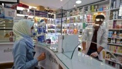 Iran -- People wearing protective masks shop at a pharmacy in the capital Tehran, February 24, 2020