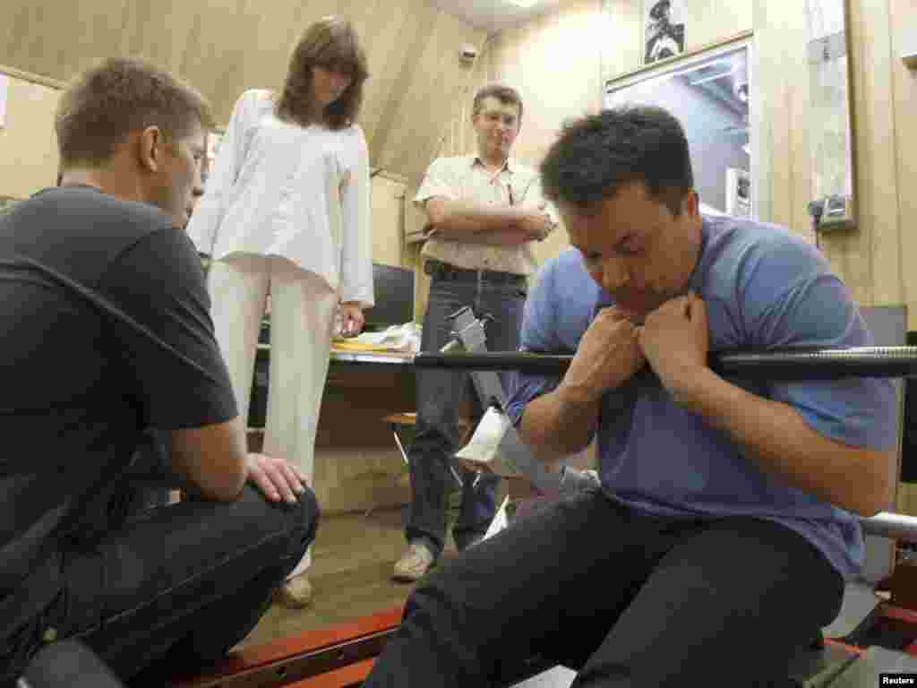 Sukhrob Kamolov (right) of Russia attends a training session inside one of the modules in Moscow.