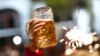 germany -- File photo of a beer being held aloft on the last day of the world's biggest beer festival, the 180th Oktoberfest, in Munich October 6, 2013. Beer sales rose in Germany, Europe's biggest producer, in the first half of the year thanks to a big j